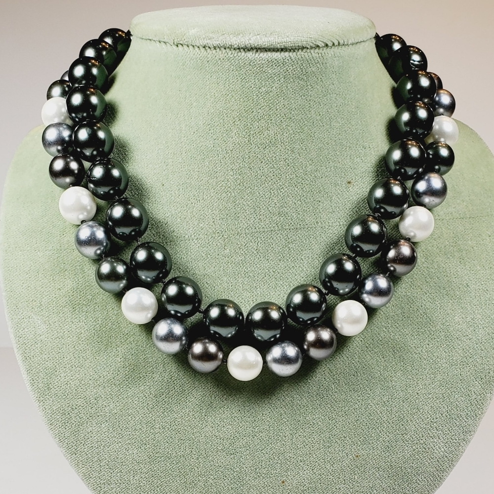 Pair of faux South Sea Peal necklaces with pave set clasps.